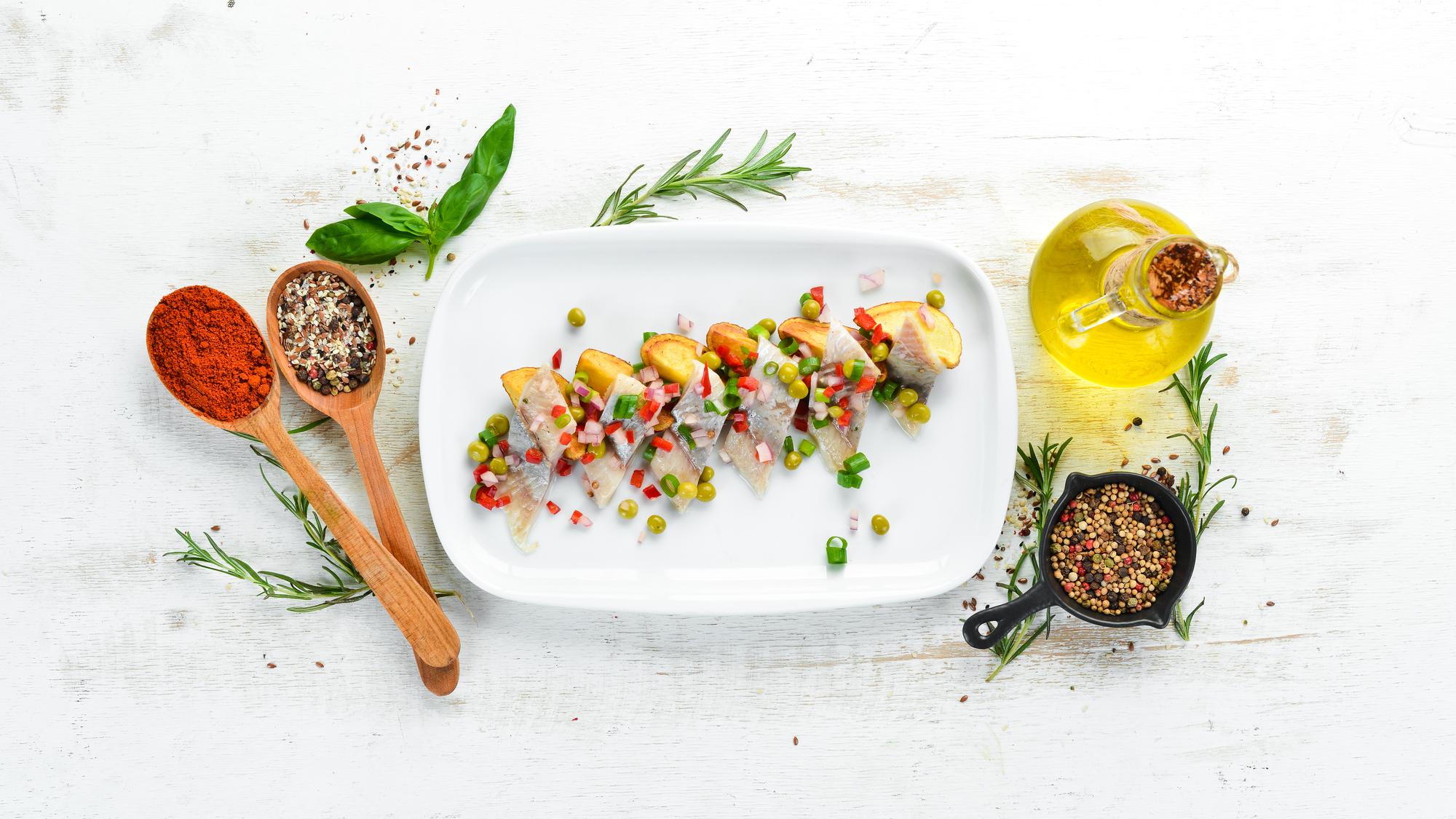 Workshop table with ingredients and plated sample dishes